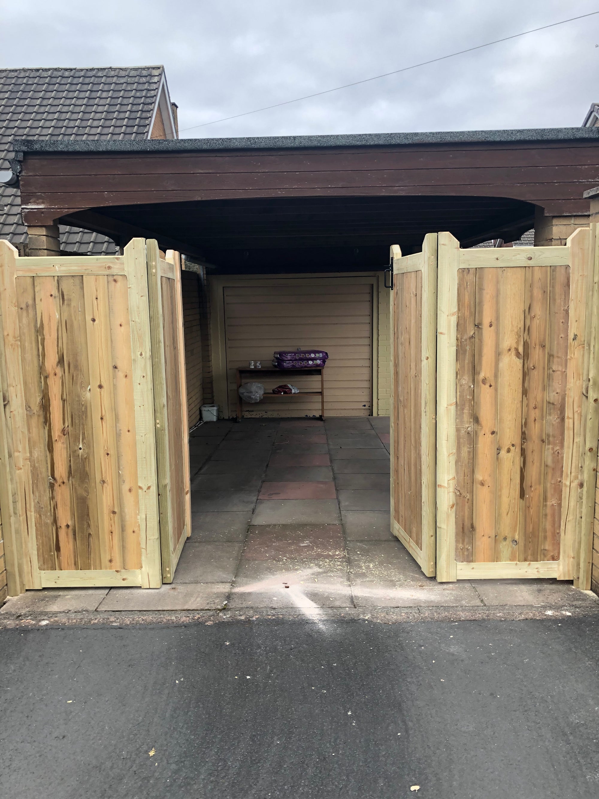 Bi fold shop wooden driveway gates